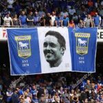 Unmissable Scenes of Passion: Ipswich Town Faithful Stun Football World With Giant Flag Unveiling in Breathtaking Display of Pride and Loyalty — Powerful Images Perfectly Capture Electric Atmosphere and Unbreakable Spirit of the Tractor Boys’ Army….