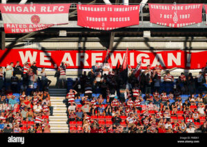 Loyalty Like No Other: Wigan Warriors Fans Unveil Colossal Flag in a Breathtaking Display of Passion — Emotional Images Capture the True Heart of Rugby League…