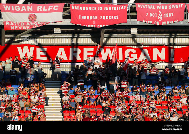 Loyalty Like No Other: Wigan Warriors Fans Unveil Colossal Flag in a Breathtaking Display of Passion — Emotional Images Capture the True Heart of Rugby League…