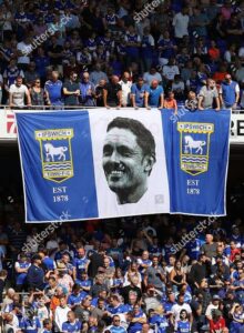 Unmissable Scenes of Passion: Ipswich Town Faithful Stun Football World With Giant Flag Unveiling in Breathtaking Display of Pride and Loyalty — Powerful Images Perfectly Capture Electric Atmosphere and Unbreakable Spirit of the Tractor Boys’ Army….