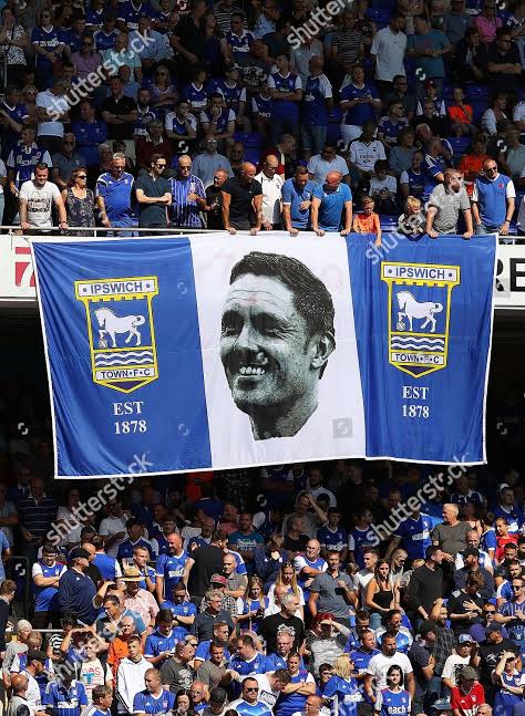 Unmissable Scenes of Passion: Ipswich Town Faithful Stun Football World With Giant Flag Unveiling in Breathtaking Display of Pride and Loyalty — Powerful Images Perfectly Capture Electric Atmosphere and Unbreakable Spirit of the Tractor Boys’ Army….